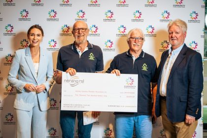 Volunteer from Nerang Country Paradise Association accepts a Community Fund cheque to help improve audio at meetings with a new amplifier.