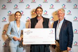 Adrian of St Brigid’s Vinnies Conference accept a Community Fund cheque to support locals in need with food and fuel vouchers.