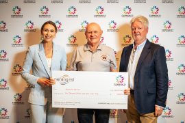 Wandering Warriors Director Audie Moldre pictured at Community Donation Day receiving funding support for the 2026 Memorial Warrior Cup.